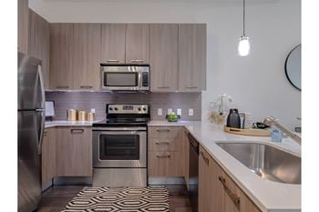 Floor plans boast details of contemporary flair with two magnificent schemes to choose from; modern quart countertops with dark wood-inspired flooring or timeless granite countertops with light ceramic tile flooring